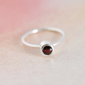 Image of Wine Red Garnet round cut classic silver ring