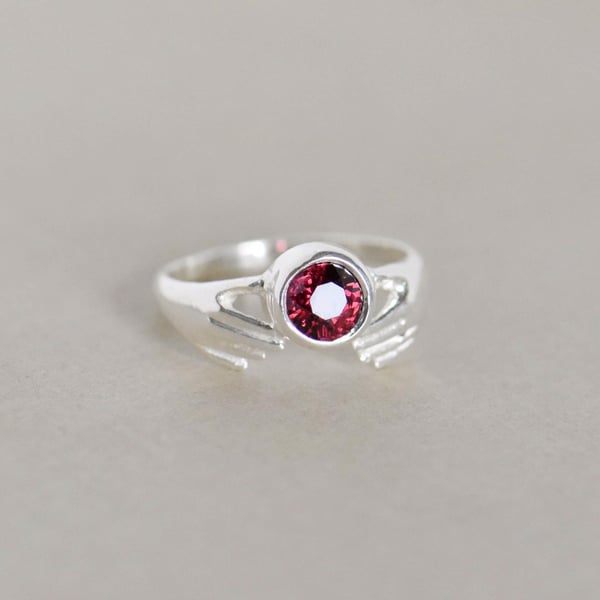 Image of Hands of Love x Red Garnet round star cut silver ring