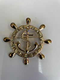 HER BROOCH 