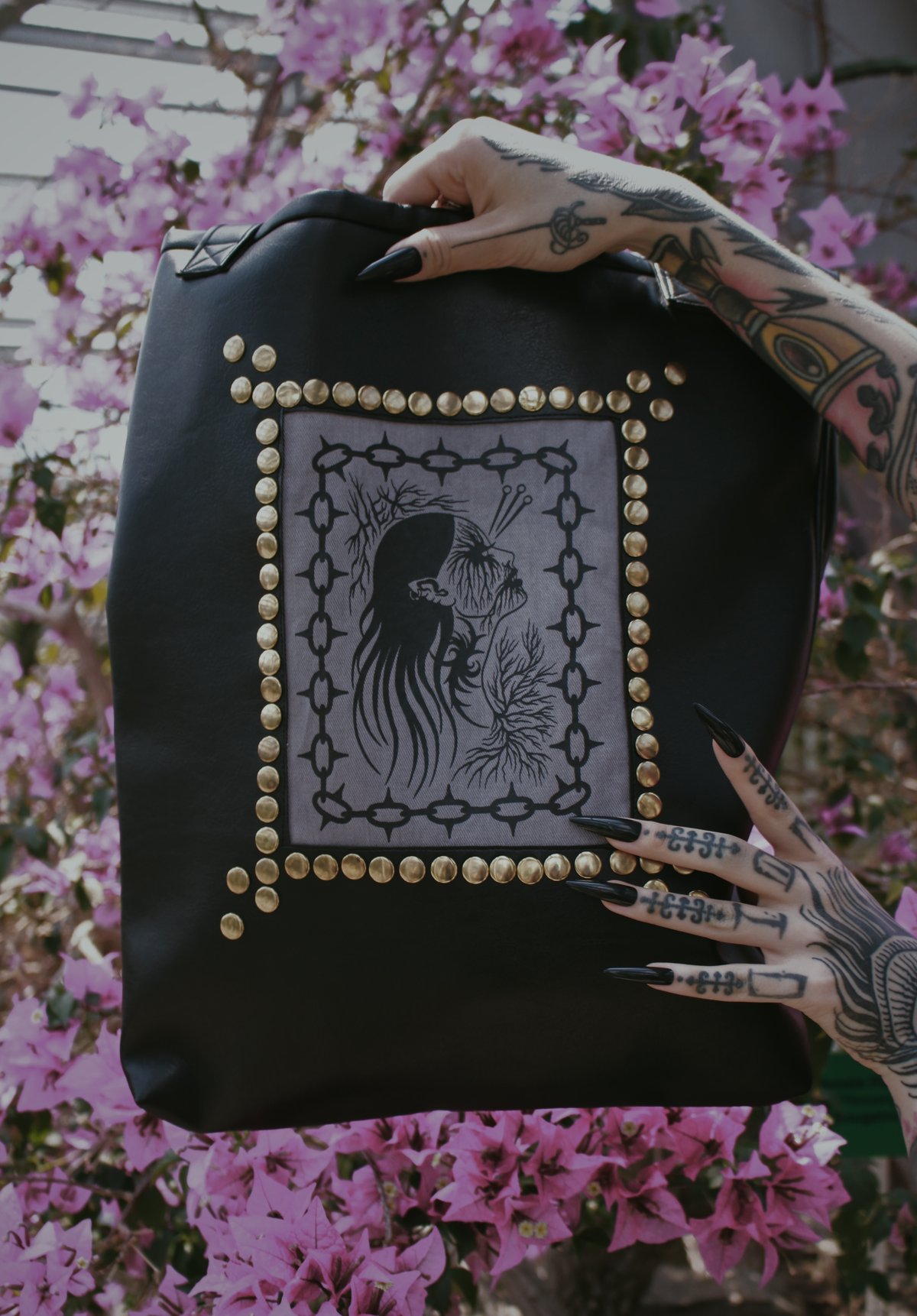 Studded bag with design by artist Sofa Oblina