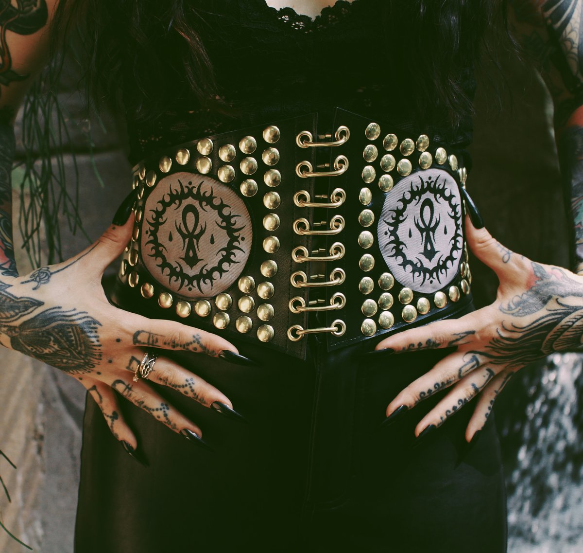 Studded belt with designs by artist Sofa Oblina