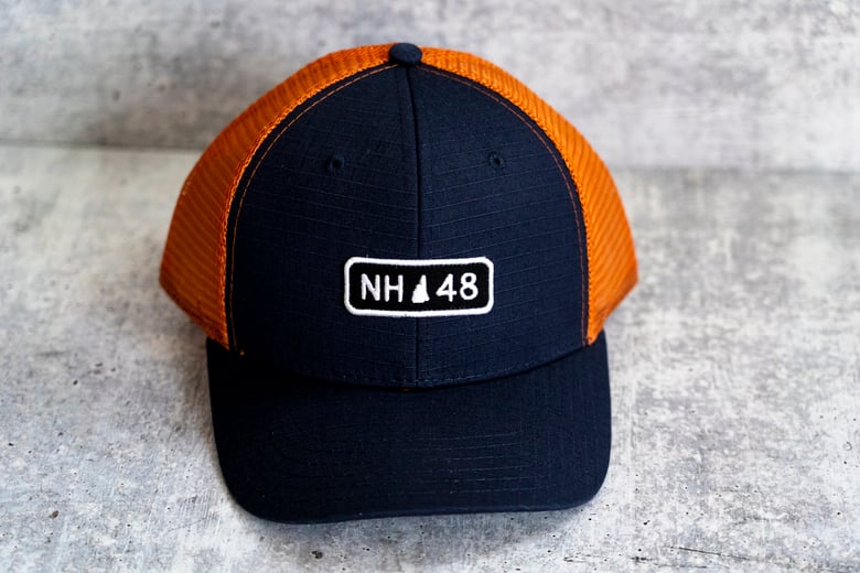 Image of NH 48 - Dark Navy/Orange Trucker Hat
