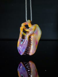 Image 1 of Silver haze T-Rex skull pendant with stargazer teeth.