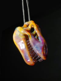 Image 2 of Silver haze T-Rex skull pendant with stargazer teeth.