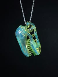 Image 1 of Yoshi (CFL) T-Rex skull pendant with illuminati (UV) teeth