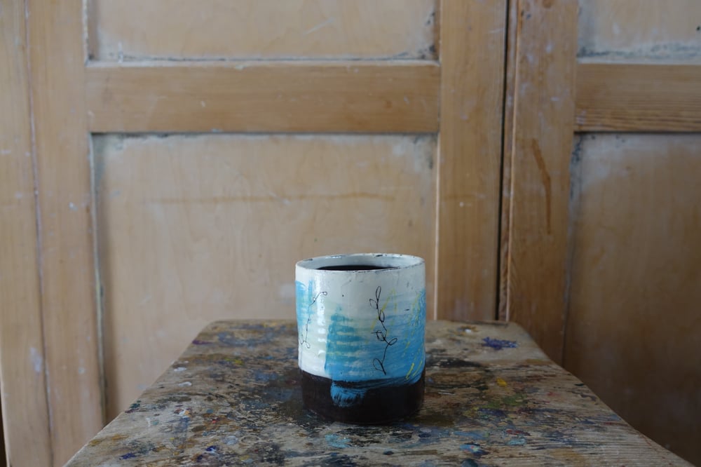 Image of Earthenware beaker with slip decoration (plants)