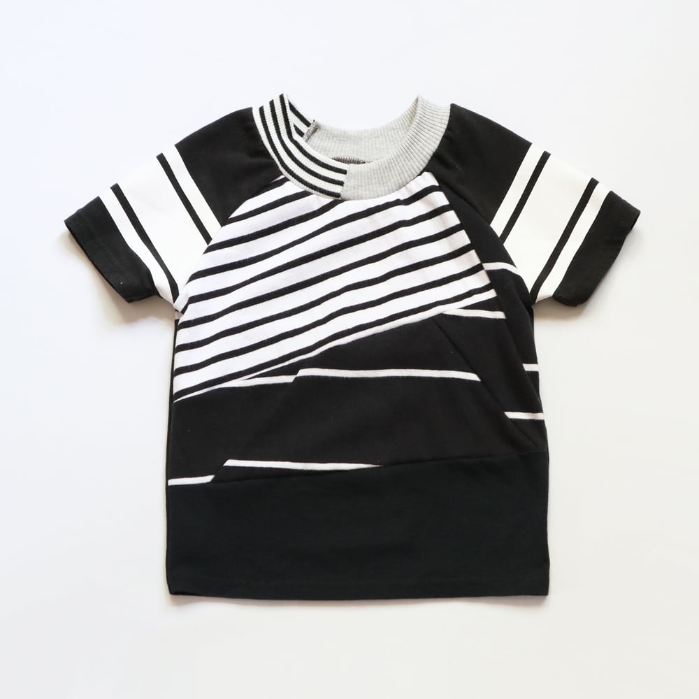 Image of black and white patchwork stripe baseball sleeve 5T courtneycourtney tee shirt unisex top