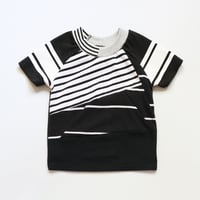 Image 1 of black and white patchwork stripe baseball sleeve 5T courtneycourtney tee shirt unisex top