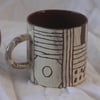 Leaky terracotta mug