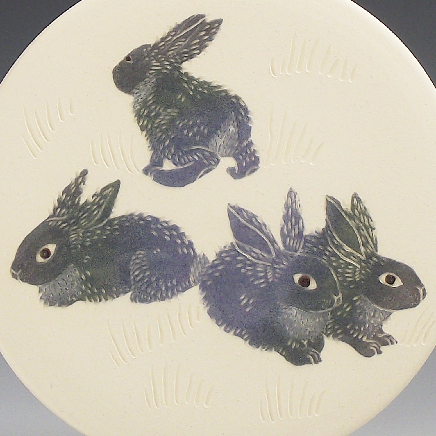 Image of Four bunnies ceramic wall hanging 