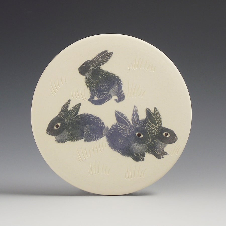 Image of Four bunnies ceramic wall hanging 