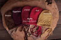 Image 2 of Newborn openwork  bonnet warm colours