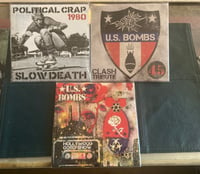 Image 1 of US BOMBS 45’s CLASH HWOOD GONG SHOW POLITICAL CRAP