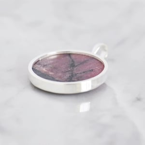 Image of Big Rhodonite round cabochon cut silver necklace