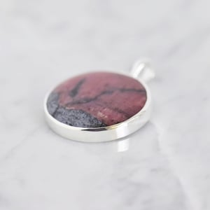 Image of Big Rhodonite round cabochon cut silver necklace
