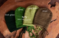 Image 2 of Newborn knitted bonnet green colours