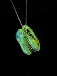 Image 1 of Fully cfl reactivecT-Rex skull pendant made with yoshi and mirage