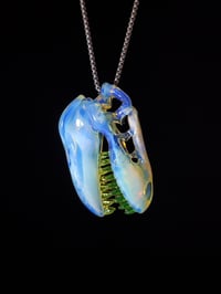 Image 1 of Fully UV reactive T-Rex skull pendant made with glopal and illuminati.