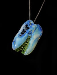 Image 3 of Fully UV reactive T-Rex skull pendant made with glopal and illuminati.