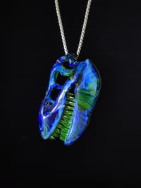 Image 4 of Irrid T-Rex skull pendant with illuminati teeth.