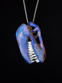 Image 1 of Opalescent T-Rex skull pendant (CFL reactive)