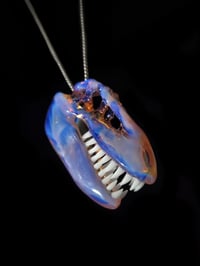 Image 3 of Opalescent T-Rex skull pendant (CFL reactive)