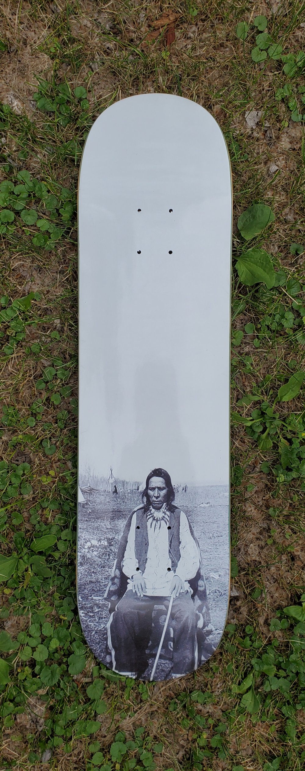 First Nations man - Sitting at Camp