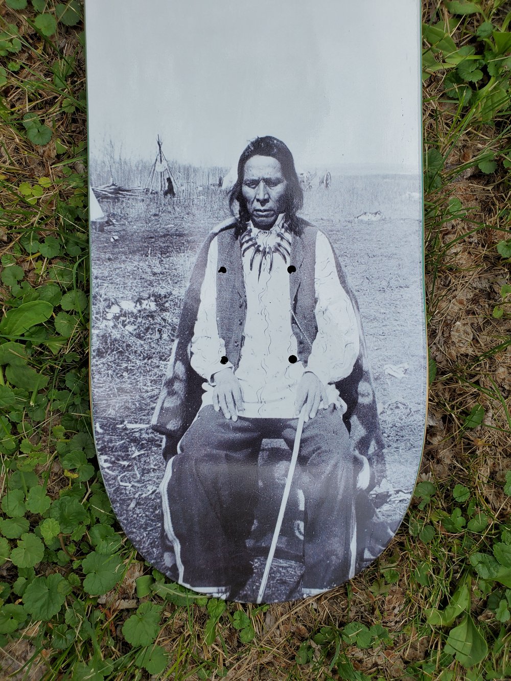 First Nations man - Sitting at Camp