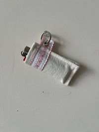 Image 1 of White and pink lighter/chapstick holder 