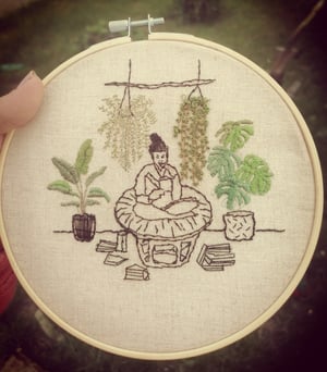 Embroidery hoop girl with her plants 