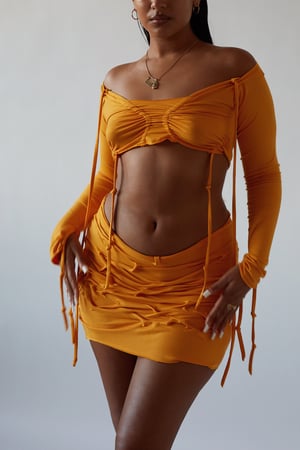 Image of yellow orange crushed mini skirt