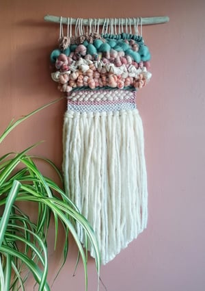 Art yarn woven wallhanging in peaches, pinks and laurel 