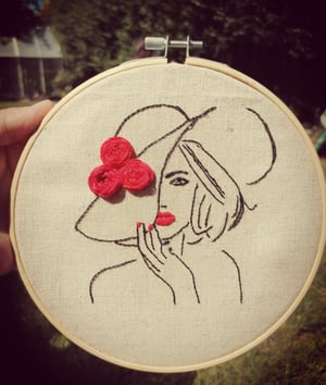 Embroidered lady in red 