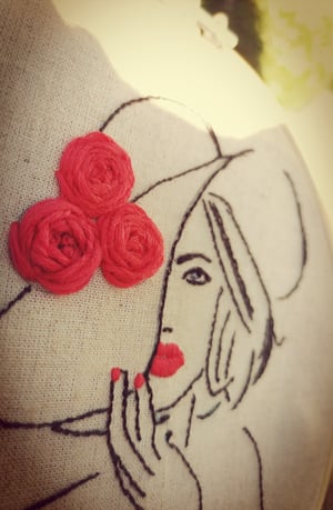 Embroidered lady in red 