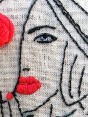 Embroidered lady in red 