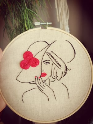 Embroidered lady in red 