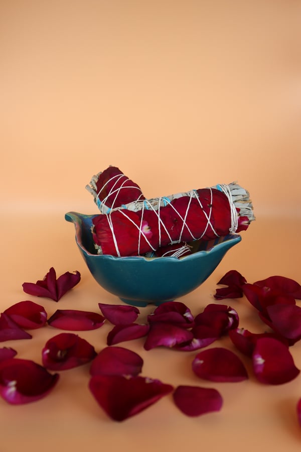 Image of Red petals and sage smudge