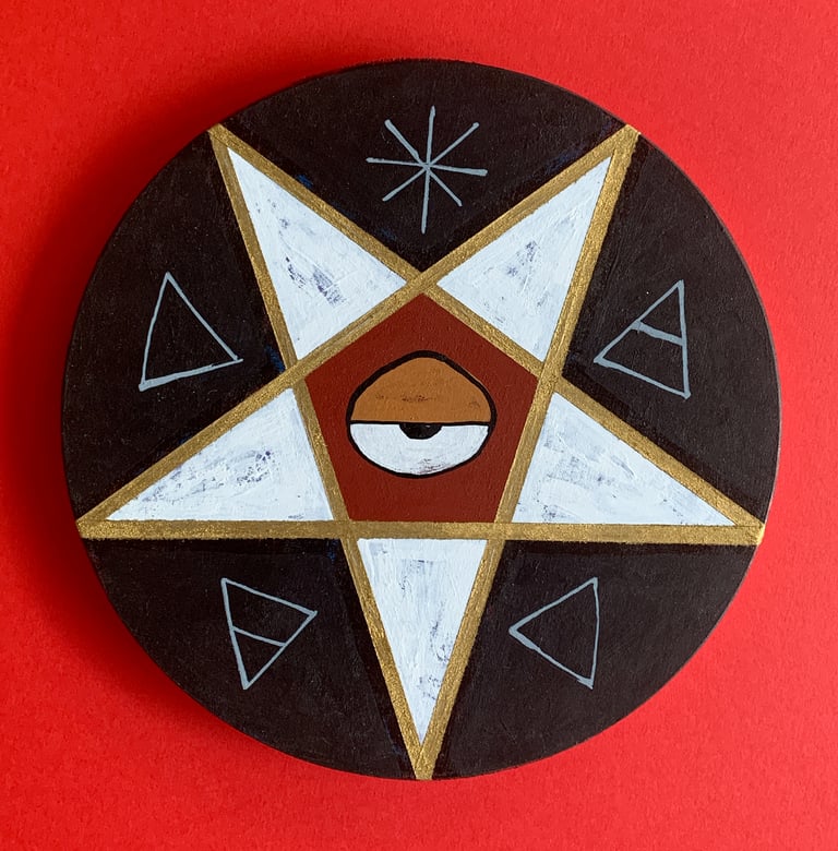 pentacle black/gold/brick-red on wood disk