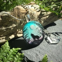 Image 1 of Wolf and Moon Twilight Forest Round Resin Pendant