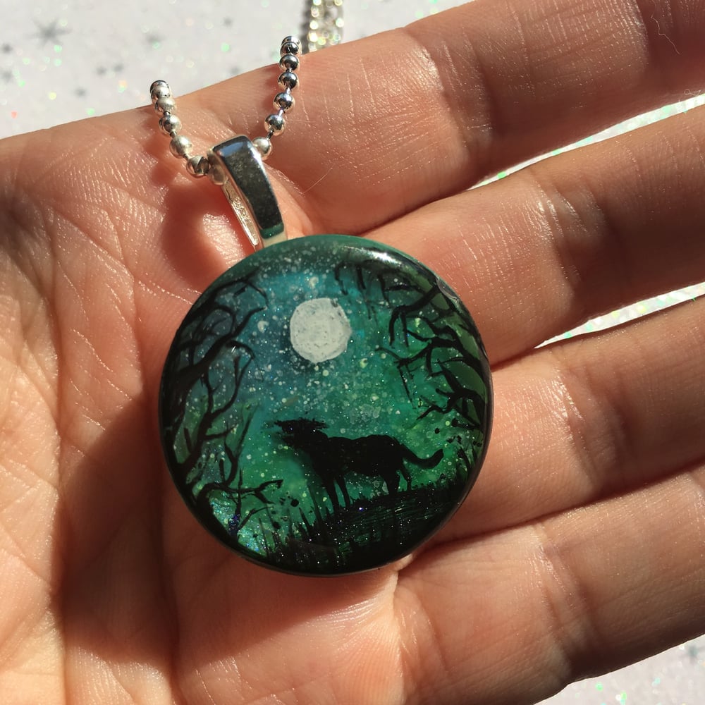 Wolf and Moon Northern Lights Round Resin Pendant