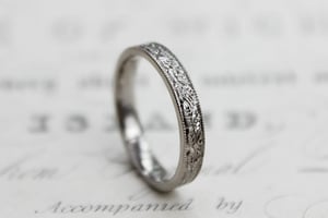 Image of Platinum 3mm flat court laurel leaf and milled edge engraved ring