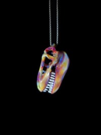 Image 2 of Silver haze T-Rex skull pendant. 