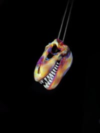 Image 3 of Silver haze T-Rex skull pendant. 