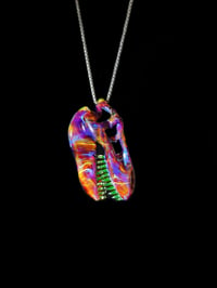 Image 4 of Amber purple T-Rex skull pendant with illuminati (UV) teeth. 