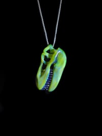 Image 3 of Green energy T-Rex skull pendant with mirage teeth. 