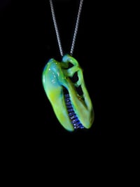 Image 4 of Green energy T-Rex skull pendant with mirage teeth. 