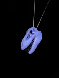 Image 2 of Lucid T-Rex skull pendant with galaxy teeth. 