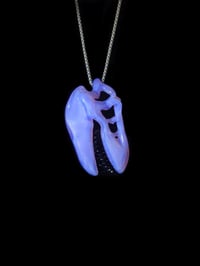 Image 3 of Lucid T-Rex skull pendant with galaxy teeth. 