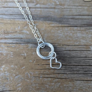 Image of Loveknot intertwined ring pendant