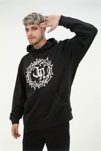Image 1 of 'The Original' Hoodie in Black with White 'JA' Logo.